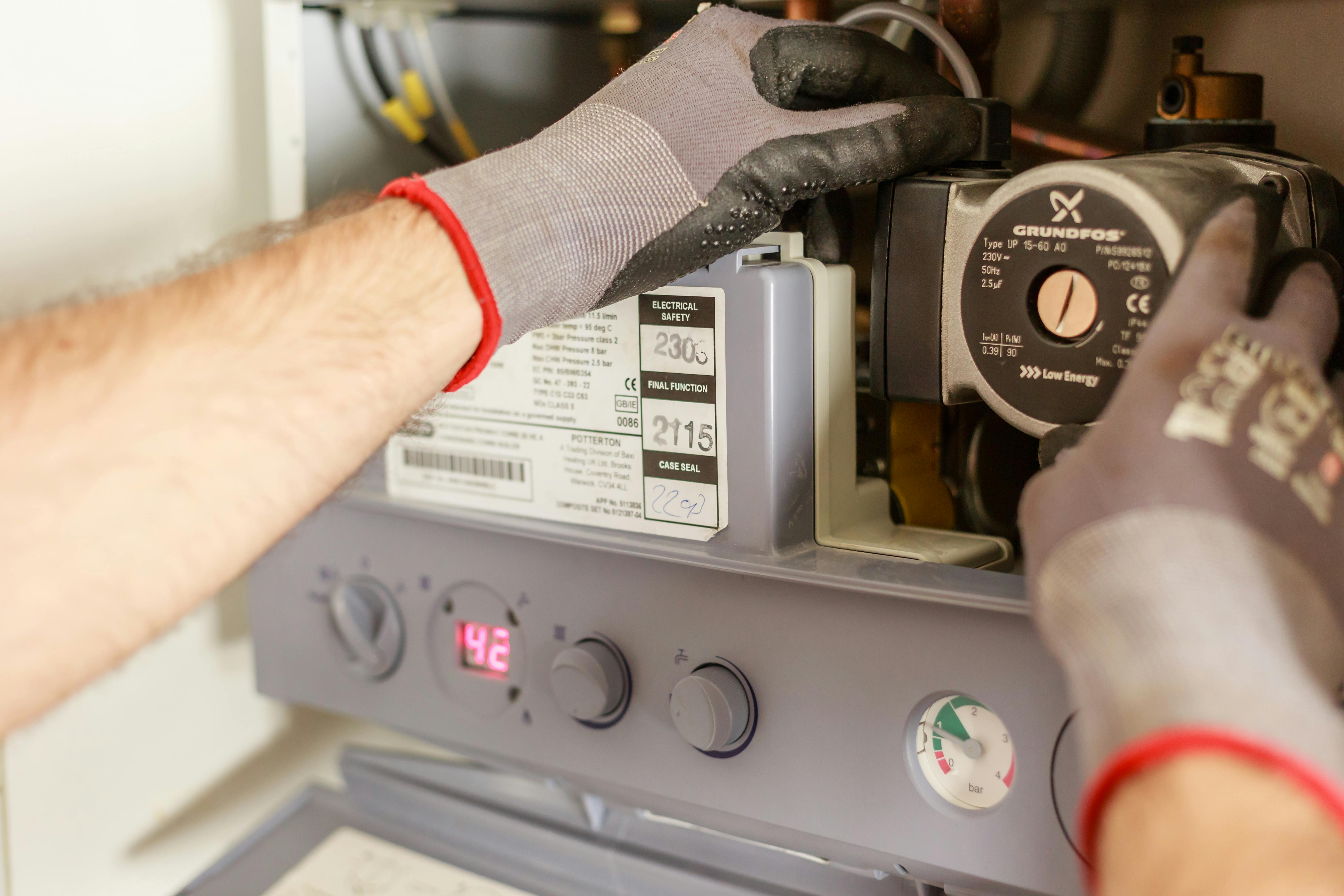Engineer servicing a domestic oil boiler
